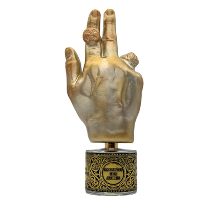 SACRISTIE DES ARBRES "Tree Vestry" Eau de Parfum by Filippo Sorcinelli features a gold-colored hand sculpture with rings, raised fingers, and an ornate base, resembling a ceremonial artifact and evoking the warmth of amber.