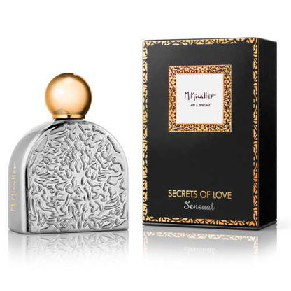 A silver perfume bottle with an ornate design and gold cap stands beside a black and gold box labeled SENSUAL Eau de Parfum by M.Micallef, an oriental floral scent featuring jasmine and sandalwood notes.