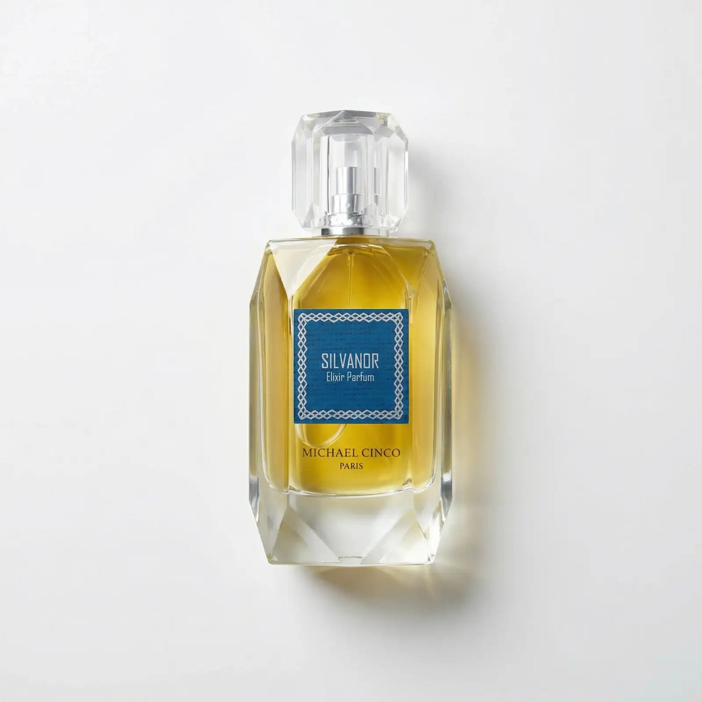 Perfume bottle labeled 'Silvandor' by Michael Cinco on a light gray background
