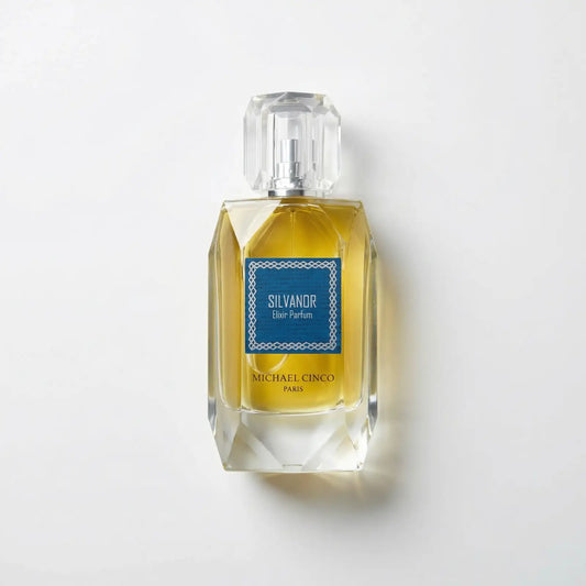Perfume bottle labeled 'Silvandor' by Michael Cinco on a light gray background