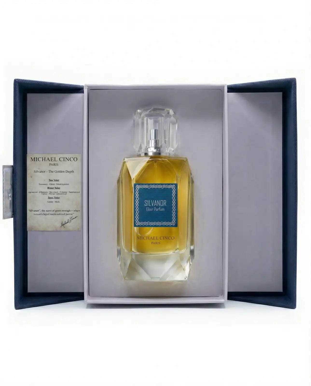 'Silvandor' by Michael Cinco  Eau de Parfum in a dark blue presentation box with a clear glass bottle containing golden-yellow liquid and a blue label.