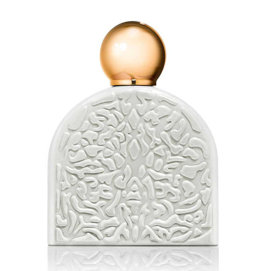 The SPIRITUAL Eau de Parfum by M.Micallef is presented in an arch-shaped bottle with a white embossed front, abstract raised pattern, and a smooth, rounded gold cap—an elegant choice for showcasing this luxurious fragrance.