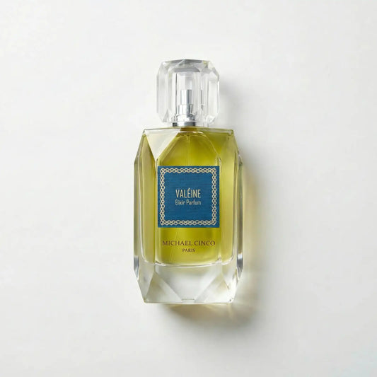 Perfume bottle labeled 'Valéine' by Michael Cinco on a light gray background