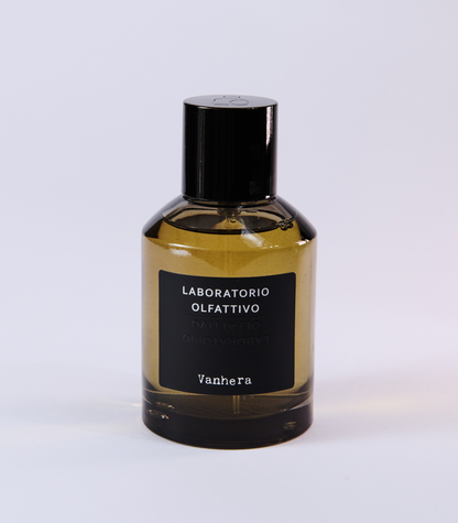 A bottle of Vanhera by Laboratorio Olfattivo, with a black label and cap, is set against a white background—highlighting this elegant fragrance known for its intriguing dark vanilla scent.